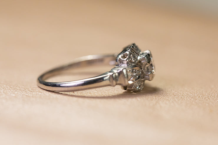 1930s Platinum Transitional Brilliant Cut Diamond Low Profile Engagement Ring with Art Deco Sunburst Motif