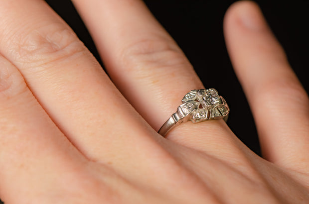 1930s Platinum Transitional Brilliant Cut Diamond Low Profile Engagement Ring with Art Deco Sunburst Motif