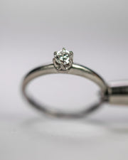 1950s Tiffany and Co. Platinum 0.17 CT G/VS1 Diamond Engagement Ring in Iconic Low Profile Crown Basket Setting