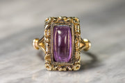 Late Georgian 9k and 14k 2.90 CT Amethyst Sugarloaf Cabochon in Rare High Relief Floral Mourning Conversion Ring